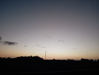 Scenic view of silhouette landscape against sky at sunset