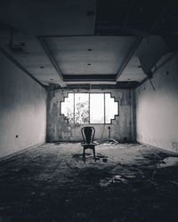 Empty chair in abandoned building