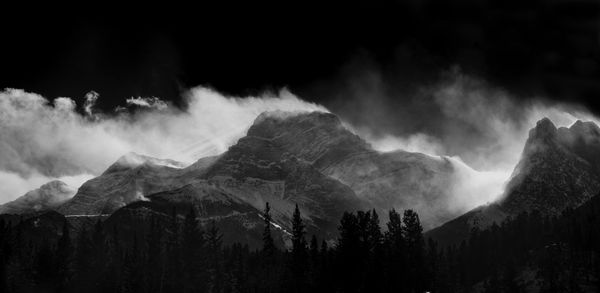 Panoramic shot of mountains against sky at night