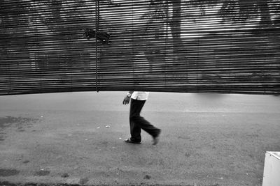 Side view of man walking on street