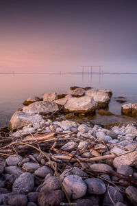 Scenic view of sea against sky at sunset