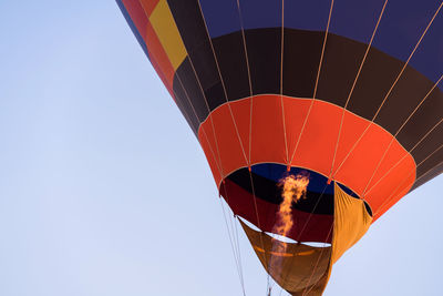 Colorful hot air balloon ready for take off in sky, freedom concept.