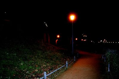 Illuminated road at night