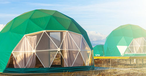 Green glamping on the pacific ocean near the volcano on kamchatka peninsula