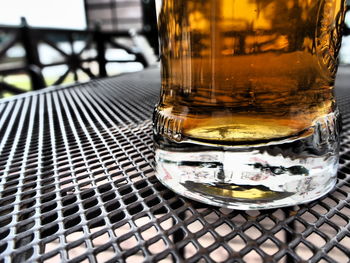 Close-up of beer glass on table