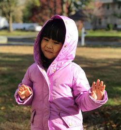 Cute girl wearing hoodie outdoors