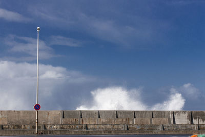 Low angle view of street light against sky