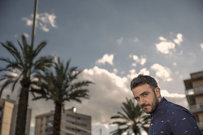 Portrait of man against sky in sunny day