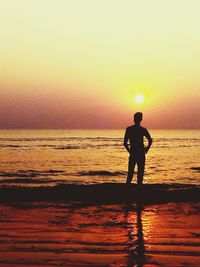 Silhouette of man standing on beach