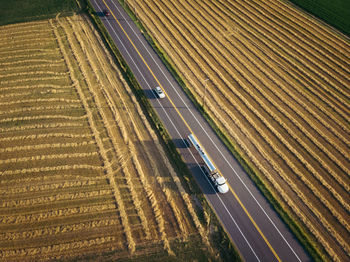 High angle view of highway amidst field