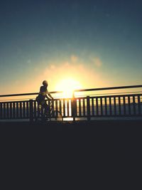 Silhouette of people at sunset