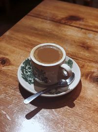 High angle view of coffee cup on table