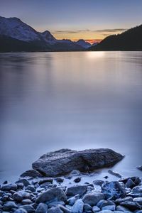 Scenic view of lake against sky during sunset