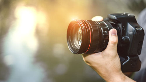 Close-up of hand holding camera