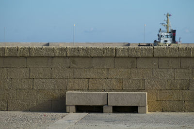 Close-up of retaining wall against clear sky