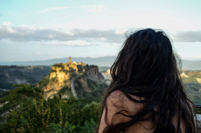 Close-up of woman against sky