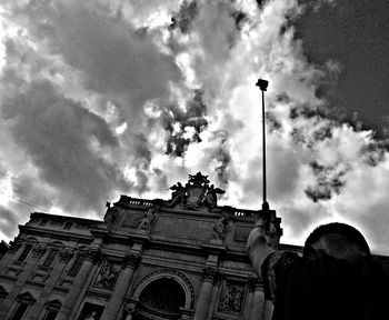 Low angle view of historical building against cloudy sky