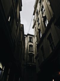 Low angle view of buildings in city against sky