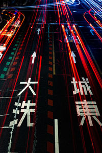 High angle view of light trails on road at night