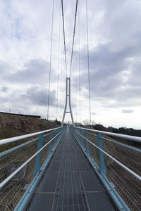 View of bridge against cloudy sky