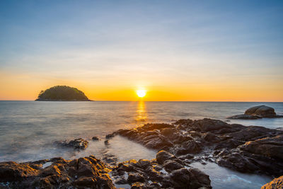 Scenic view of sea against sky during sunset