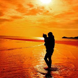 Scenic view of sea at sunset