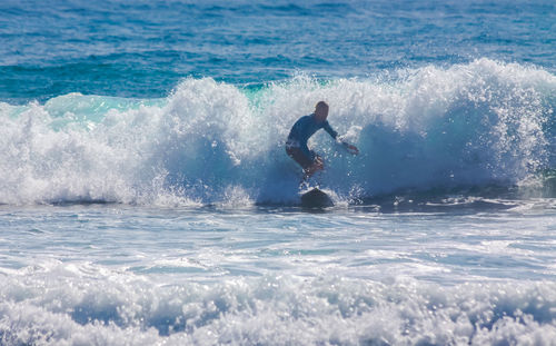 Man surfing in sea