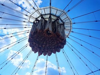 Low angle view of ferris wheel against sky