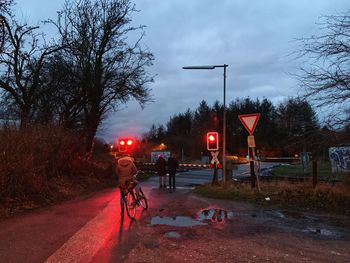 People on street at dusk