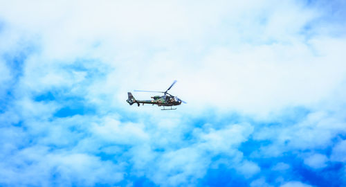 Low angle view of airplane flying in sky