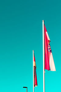 Flag flags against blue sky