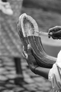 Close-up of man cutting a pumpkin 