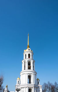 Low angle view of building against clear blue sky