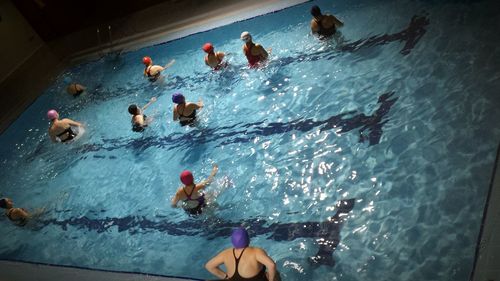 High angle view of people swimming in water