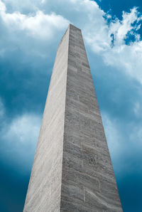 Low angle view of monument against cloudy sky