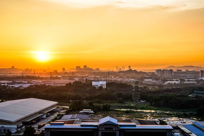 High angle view of buildings against sky during sunset