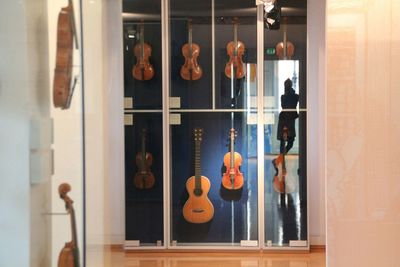 Violins in shelf for sale