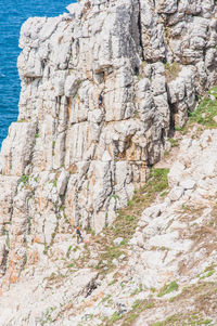 View of rock formations in sea