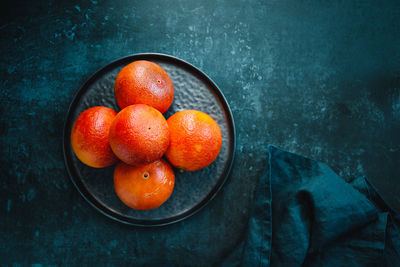 High angle view of oranges in bowl on table