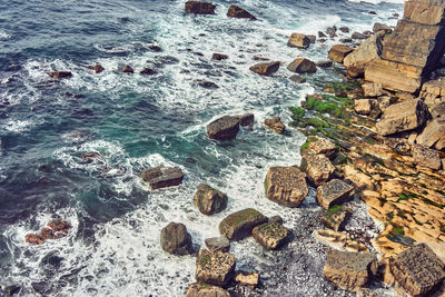 High angle view of pebbles on beach