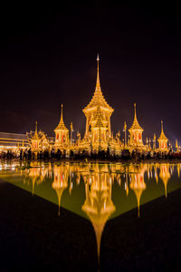 Reflection of illuminated buildings in water at night