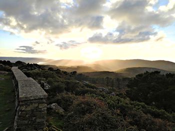 Scenic view of landscape against sky during sunset