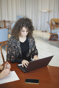 Woman using laptop in office