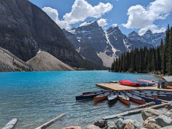 Scenic view of sea and mountains against sky