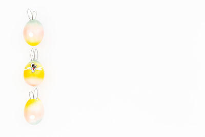 Close-up of multi colored lights on white background