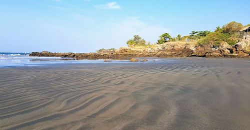 Scenic view of beach against clear sky