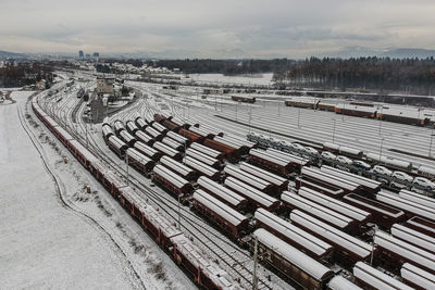 High angle view of train on snow covered railroad tracks