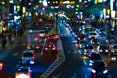 Illuminated city street at night