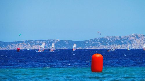 View of sea against clear blue sky