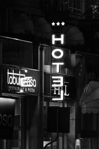 Information sign in illuminated city at night